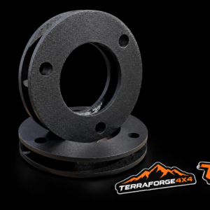 Two SsangYong Rexton front lift spacers on black with TerraForge4x4 stickers
