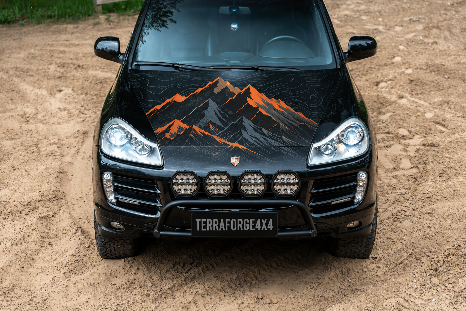 Front view with TerraForge4x4 mountain bonnet graphic and show plate